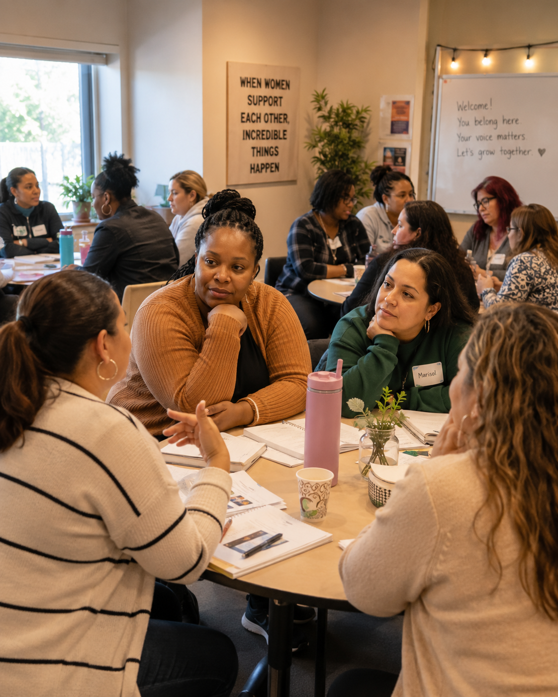Mothers in a cohort group setting — warm, engaged, and purposeful